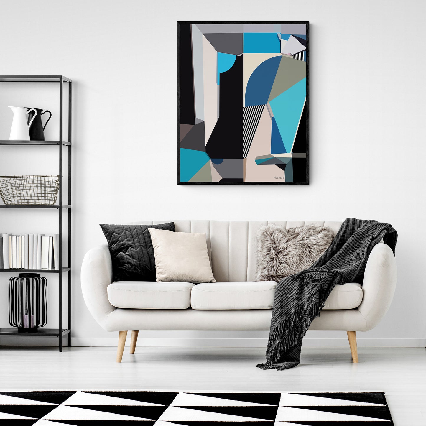 Modern living room with a white sofa, blue abstract art, and geometric rug.