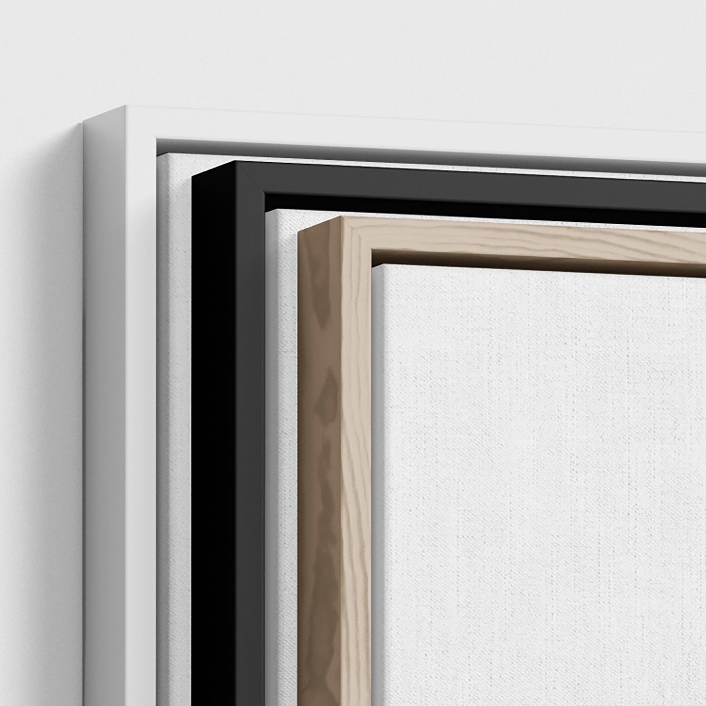 Close-up of a black and wooden picture frame corner on a white background