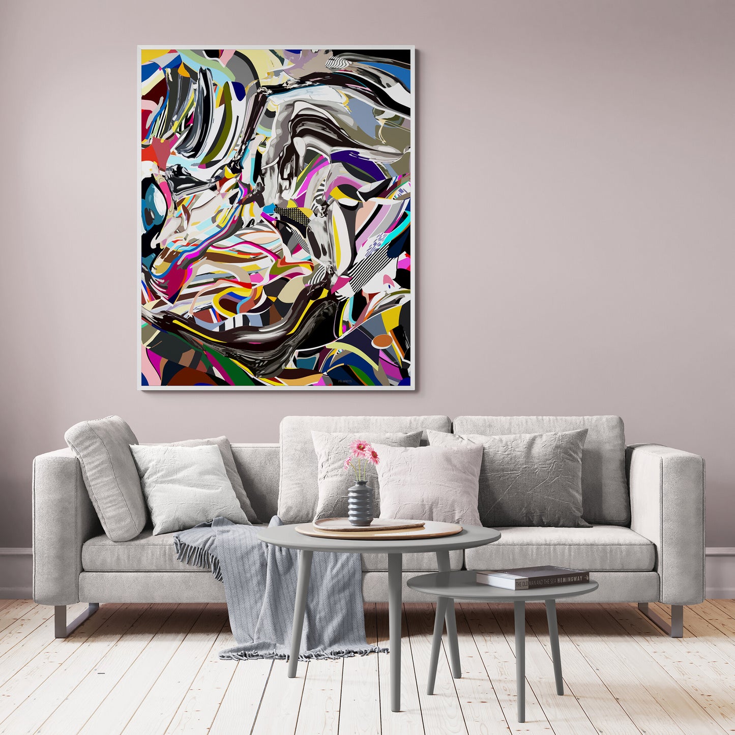 Living room with a gray sofa, coffee table, and abstract painting on the wall.