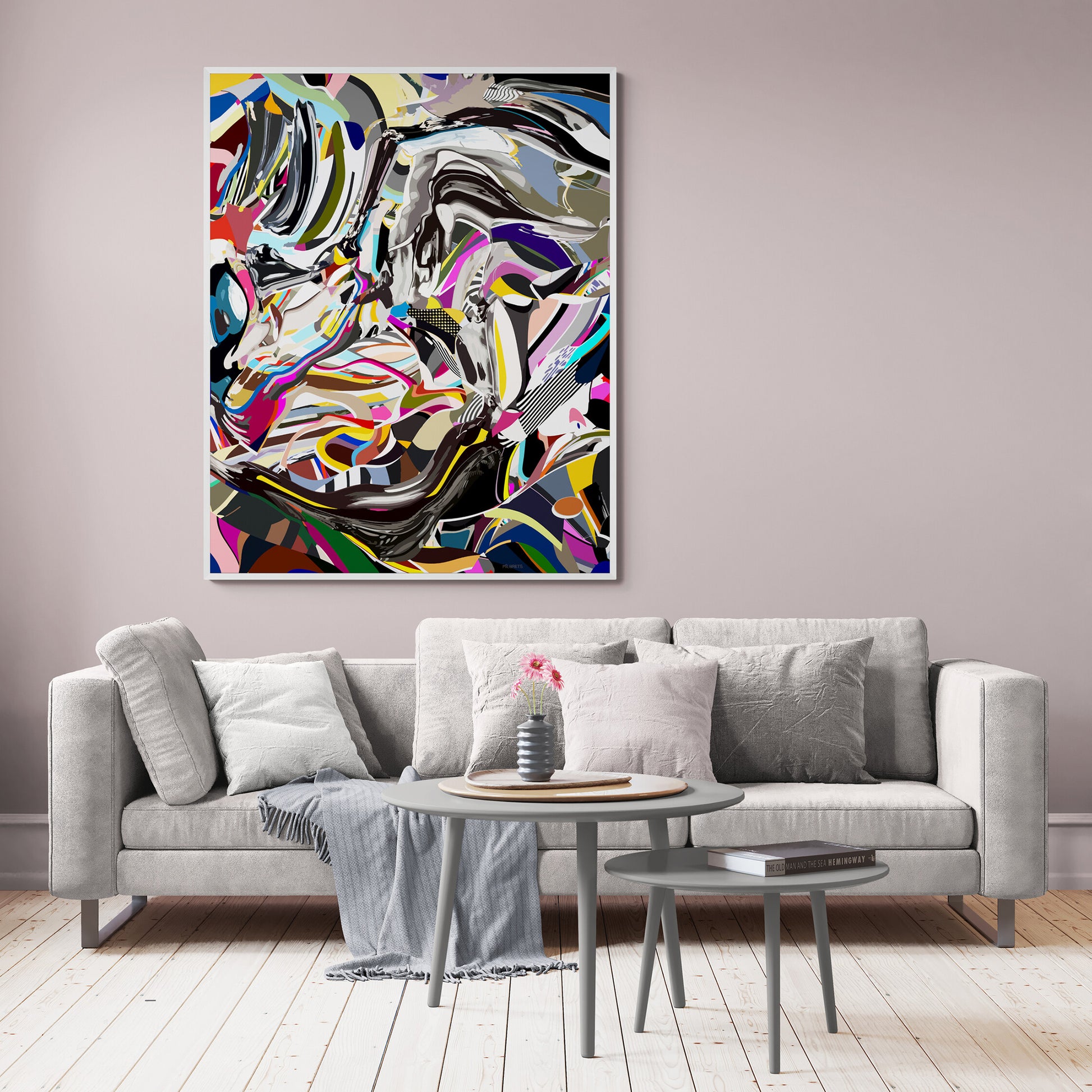 Living room with a gray sofa, coffee table, and abstract painting on the wall.
