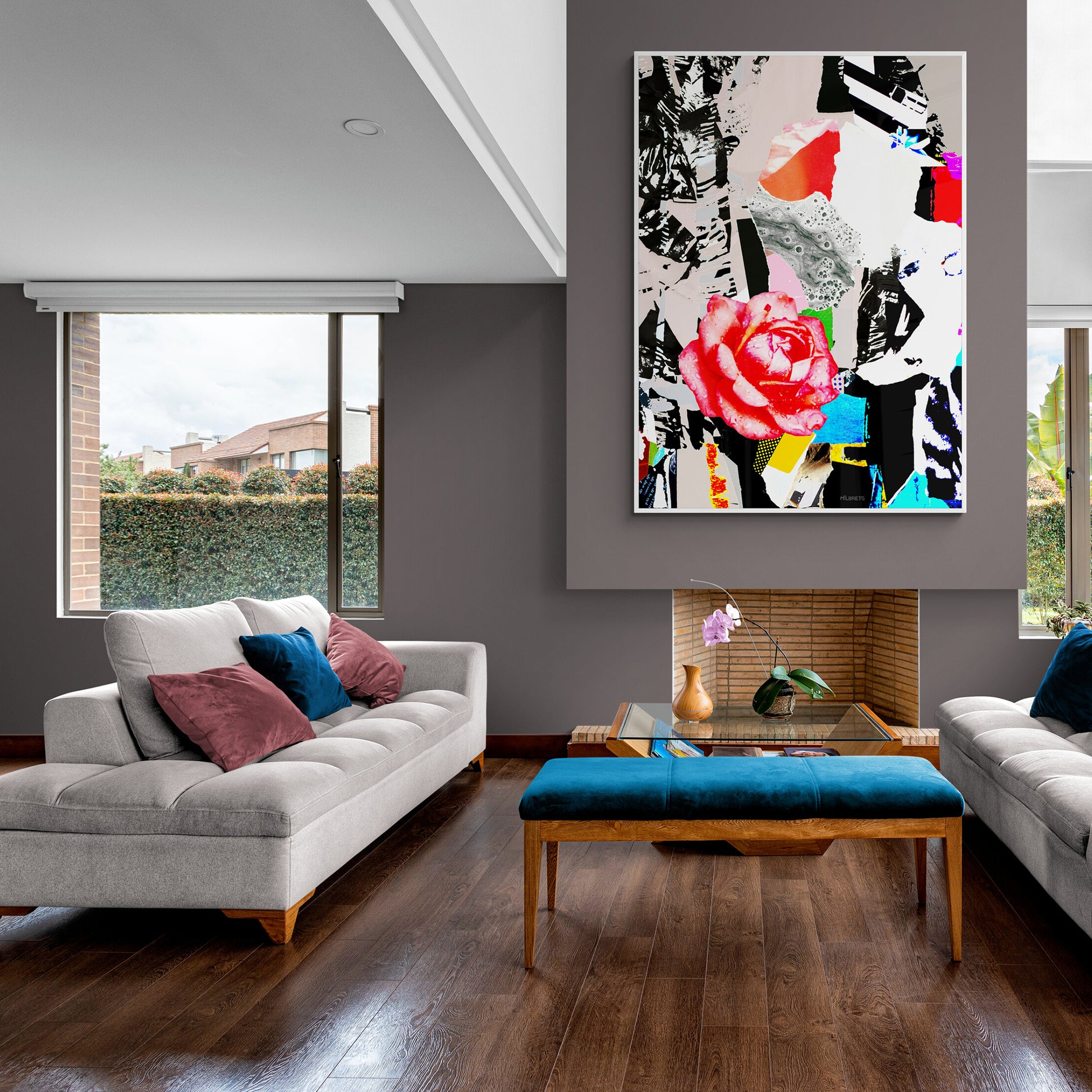Modern living room with a gray sofa, colorful floral abstract painting, and a bench.