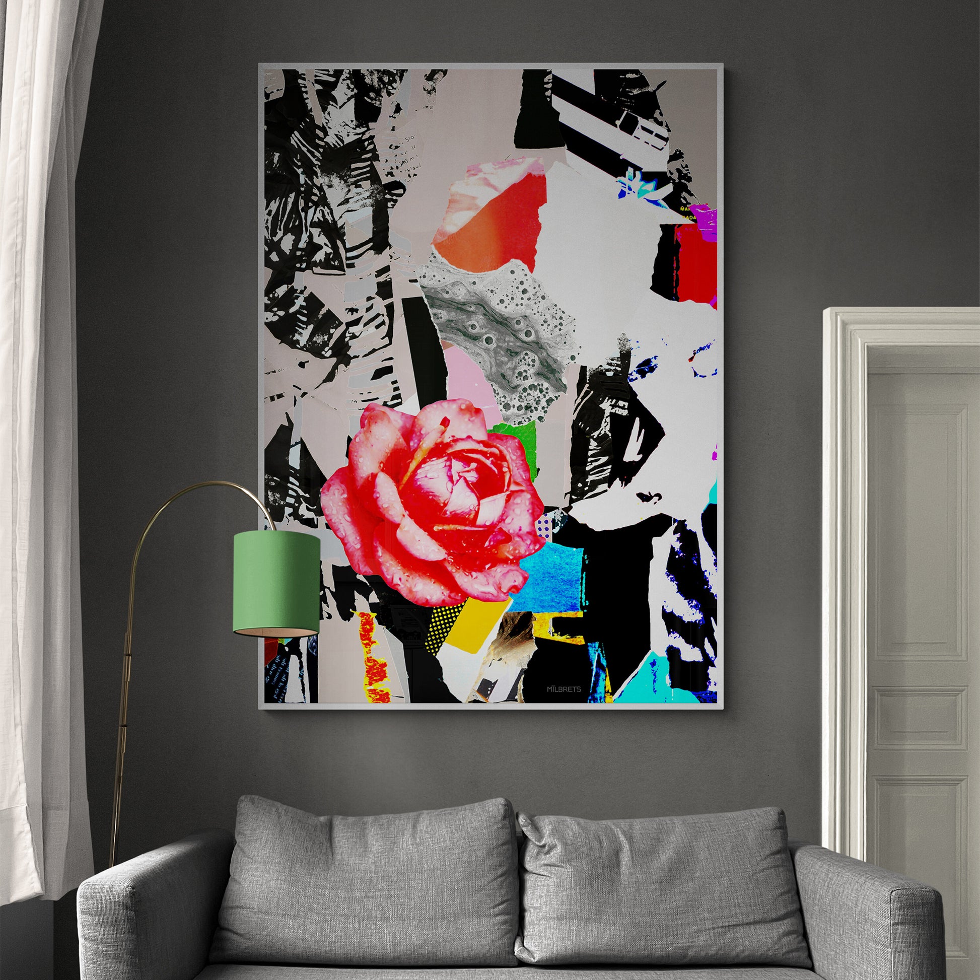 Colorful abstract floral art piece on a gray wall above a gray sofa.