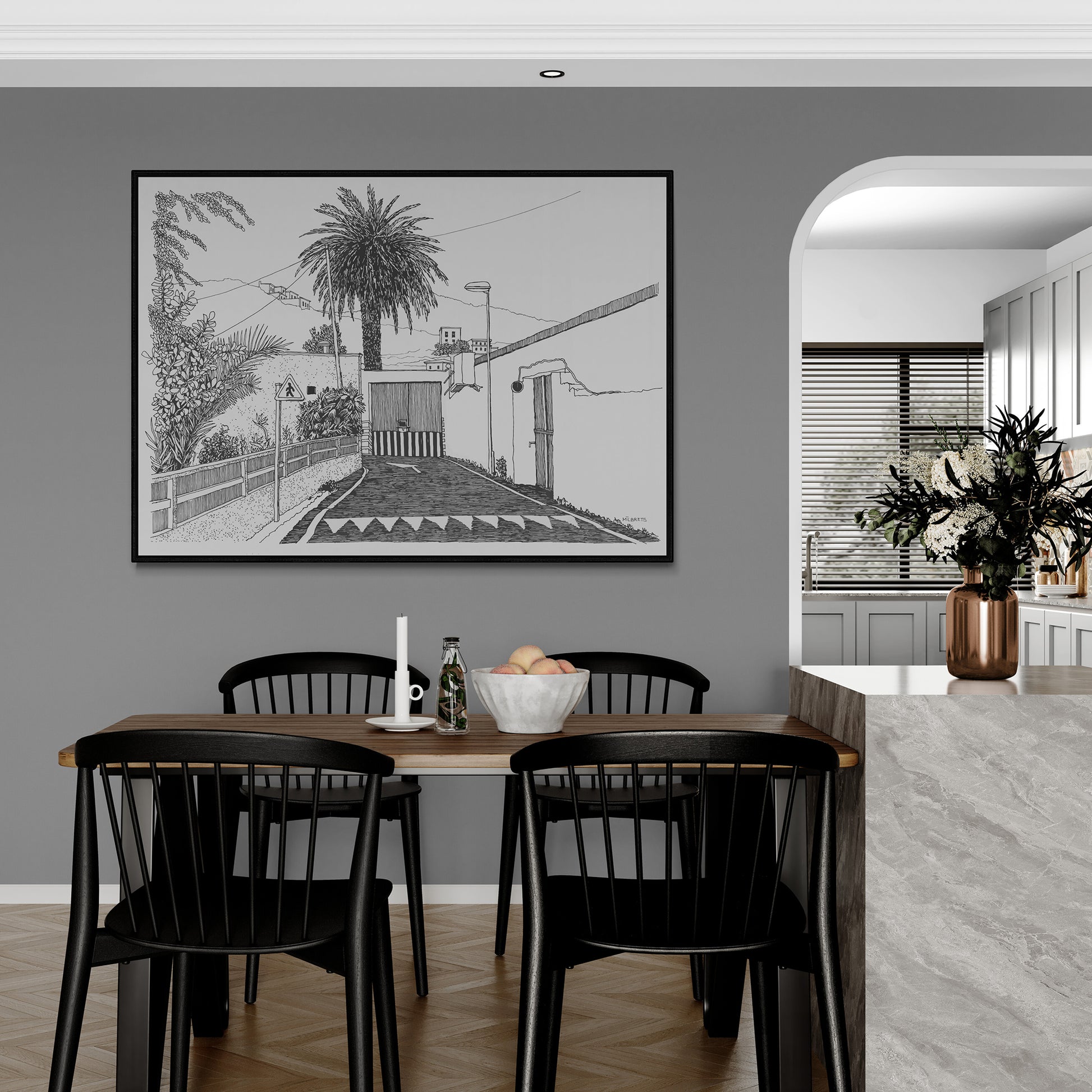 Dining area with black chairs, wooden table, and a large framed tropical black and white artwork on the wall.