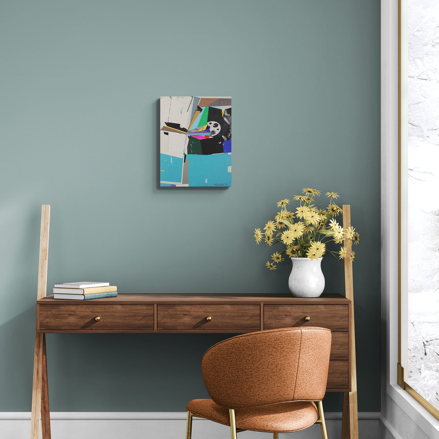 Wooden desk with a chair, vase of flowers, and abstract painting on a teal wall.