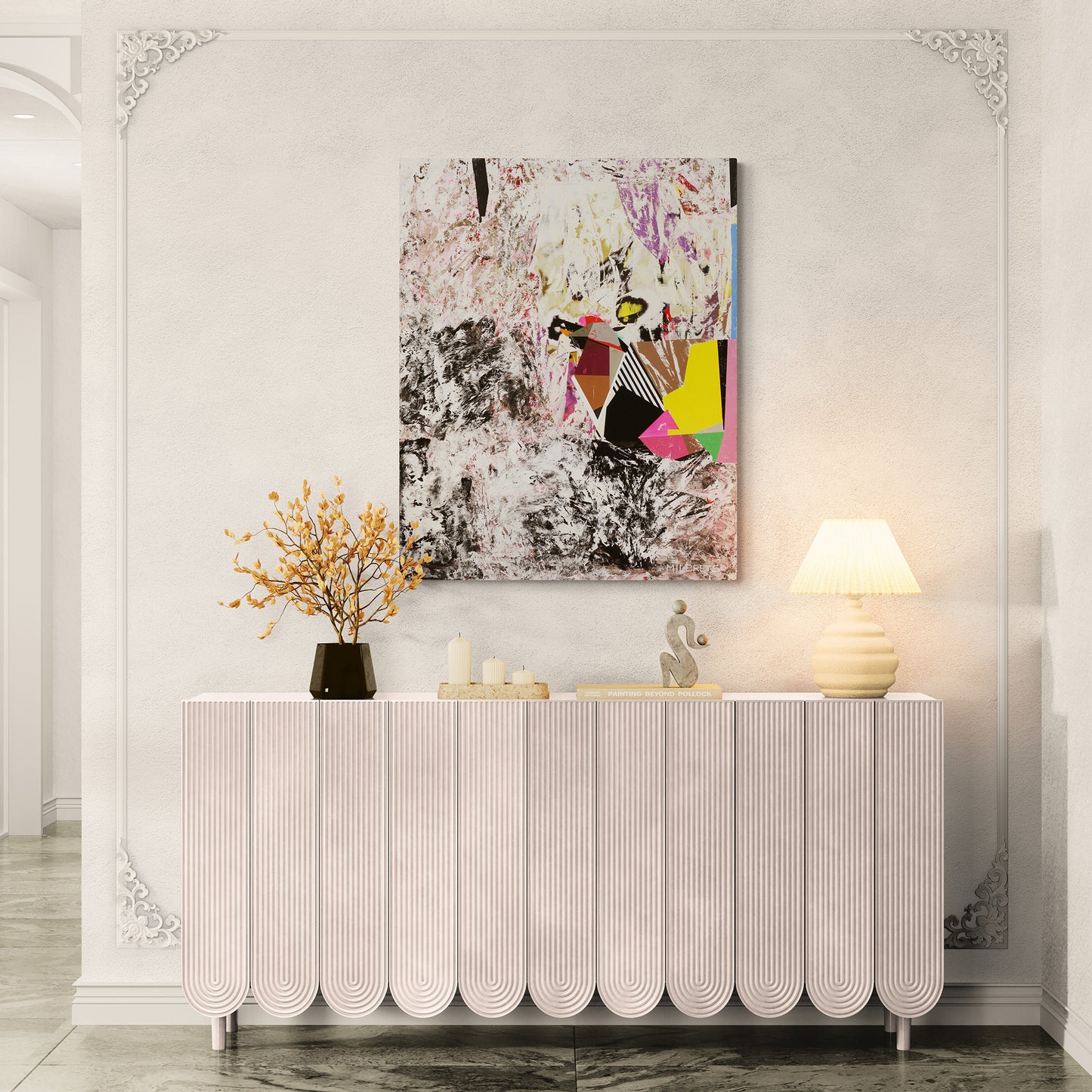 Decorative console table with a colorful abstract painting above it in a stylish room.
