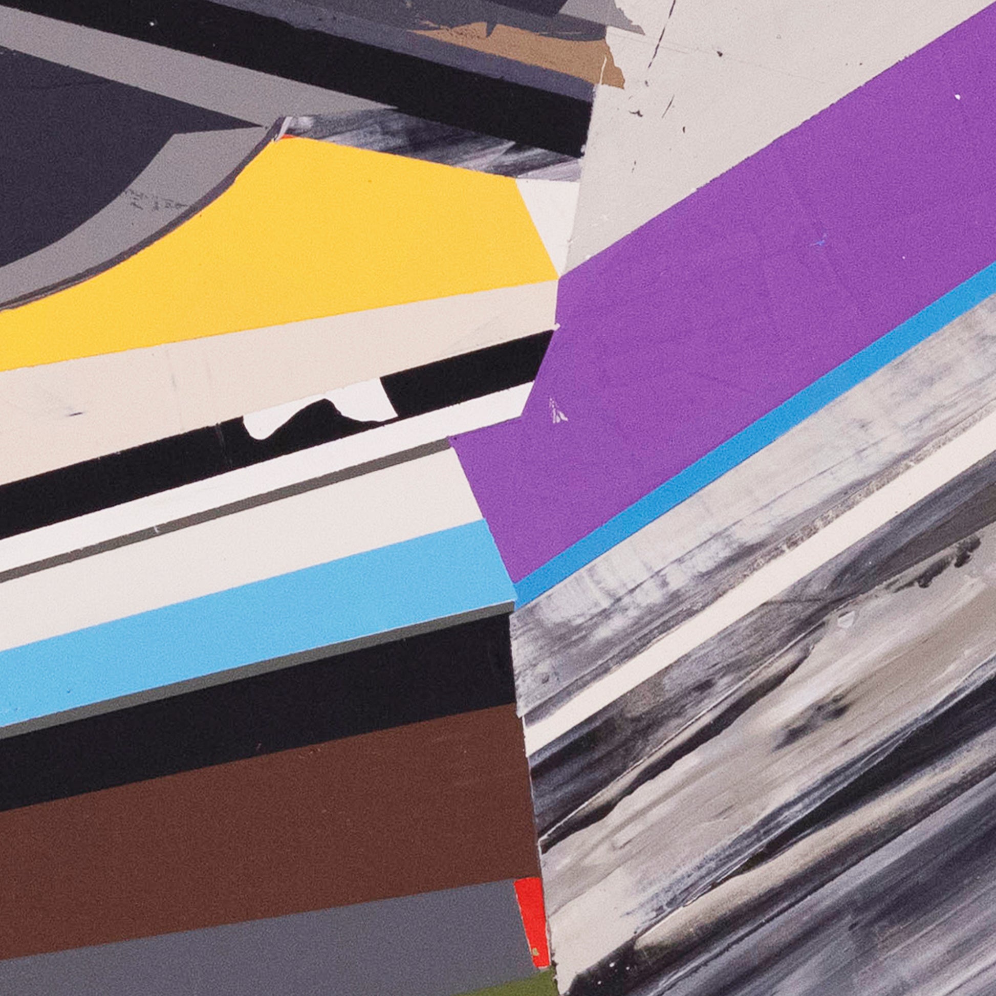 Detail of an abstract art piece with geometric shapes in various colors on a textured surface.