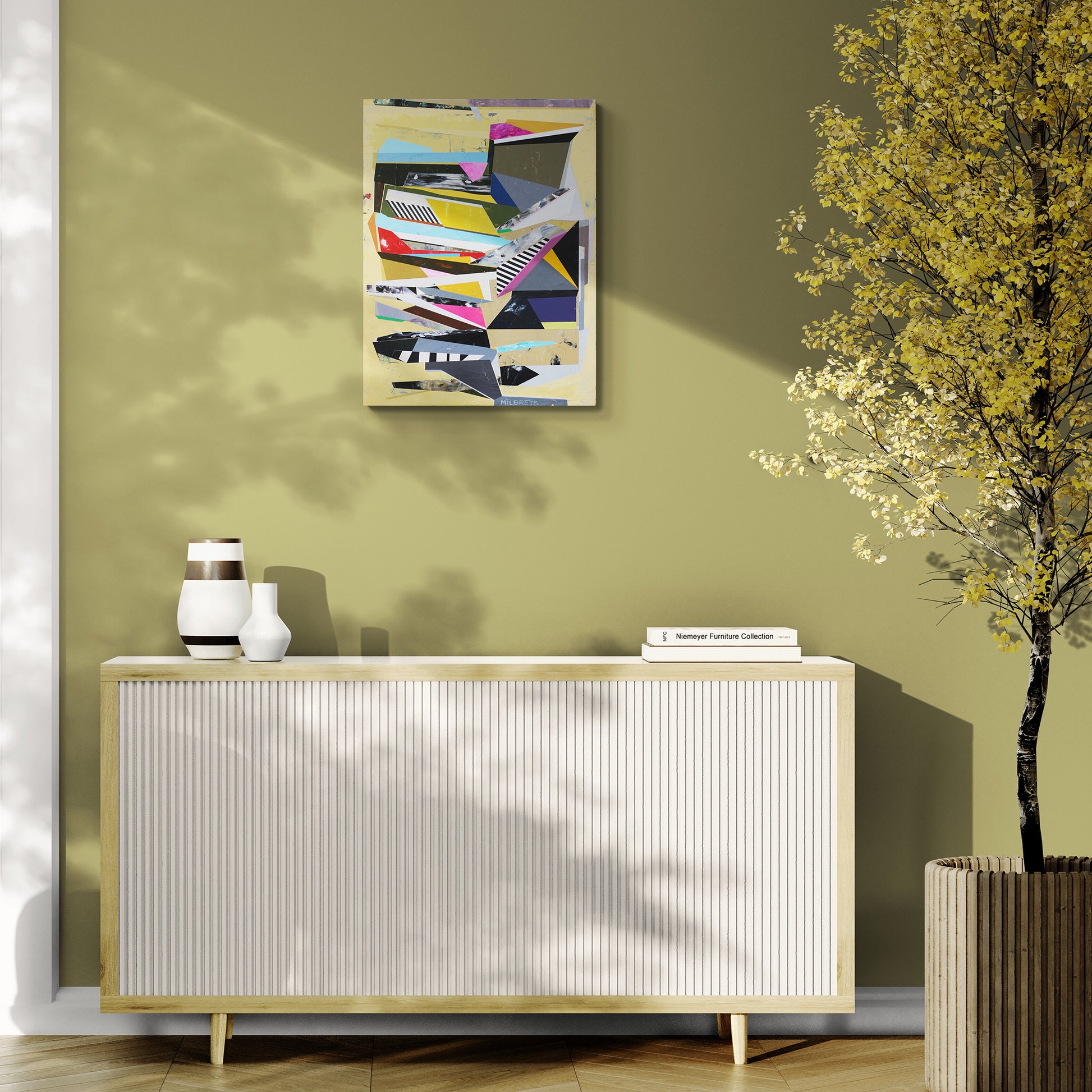 Modern interior with a sideboard, decorative items, and a colorful abstract painting on a green wall.