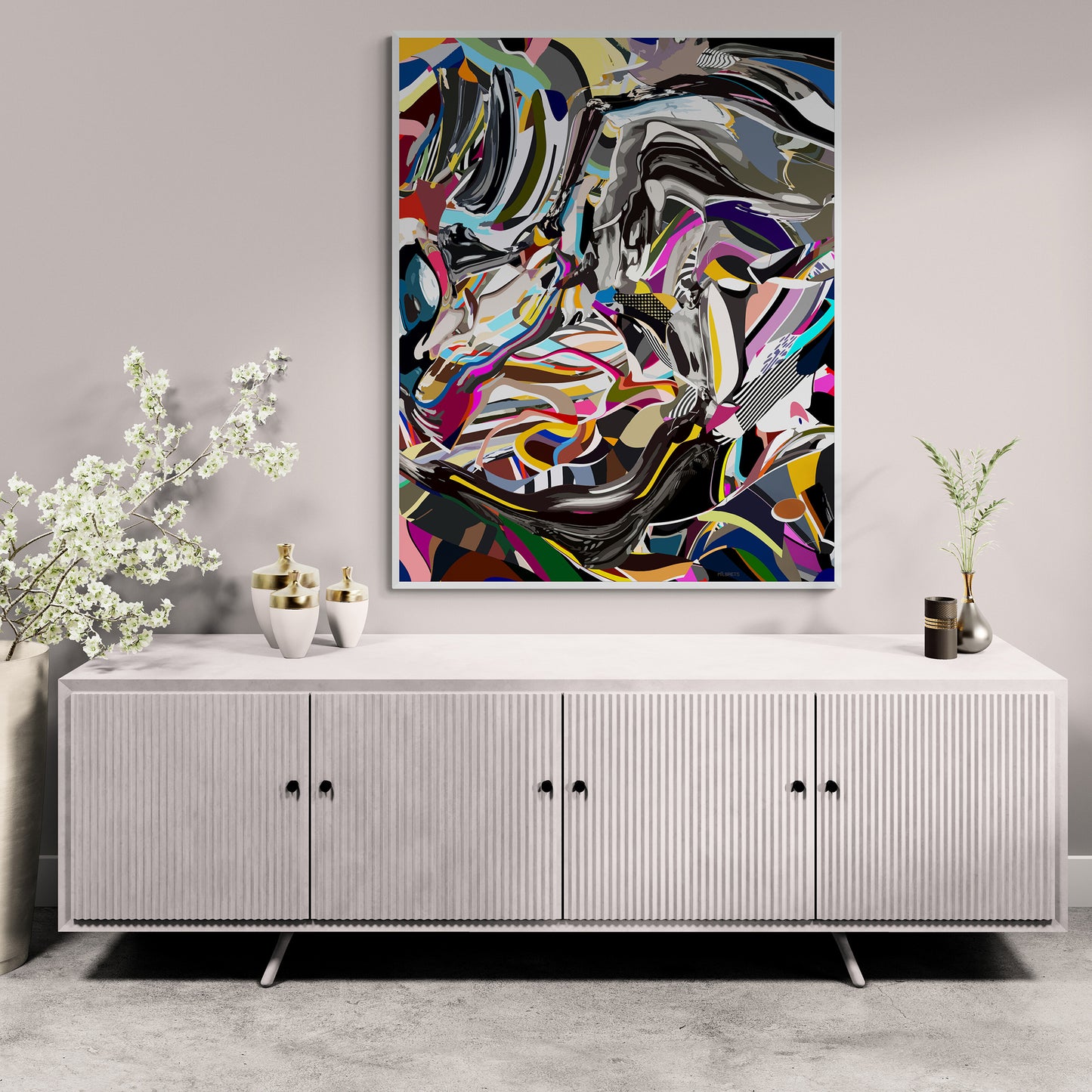 Abstract artwork on a wall above a white cabinet with decorative items.