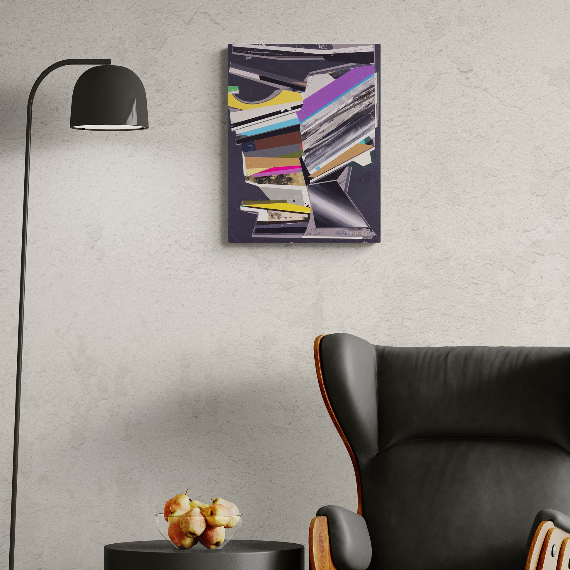 Abstract painting on a wall above a black chair and small table with decorative items.