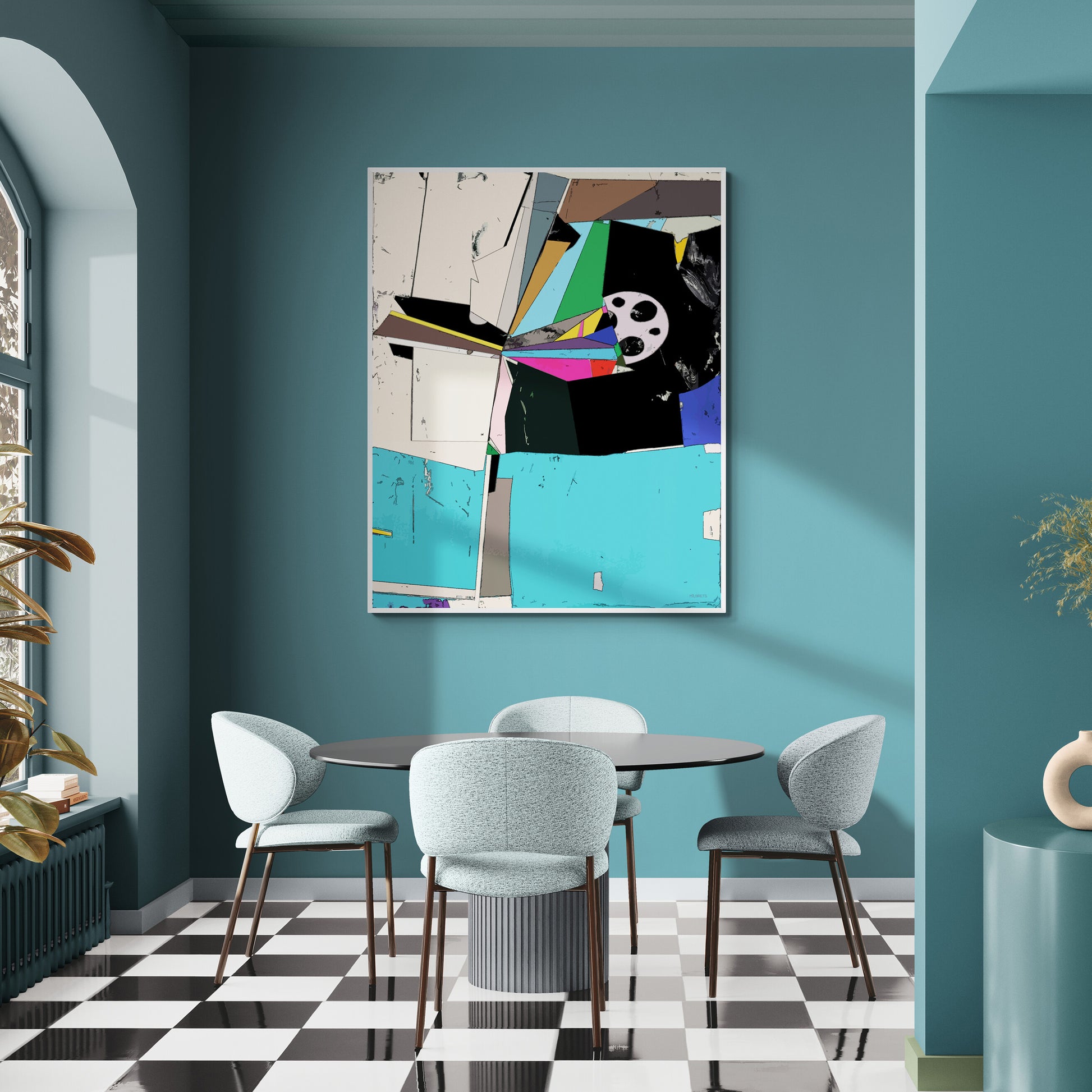 A framed abstract geometric wall art print hangs on a teal wall above a dining table and chairs in a modern room with a black-and-white checkered floor.